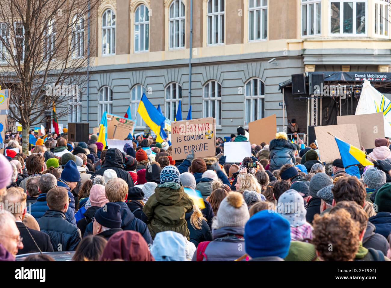 Ukrainian flags in front of the Russian embassy in Copenhagen, a banner waring for nuclear war, February 27, 2022 Stock Photo