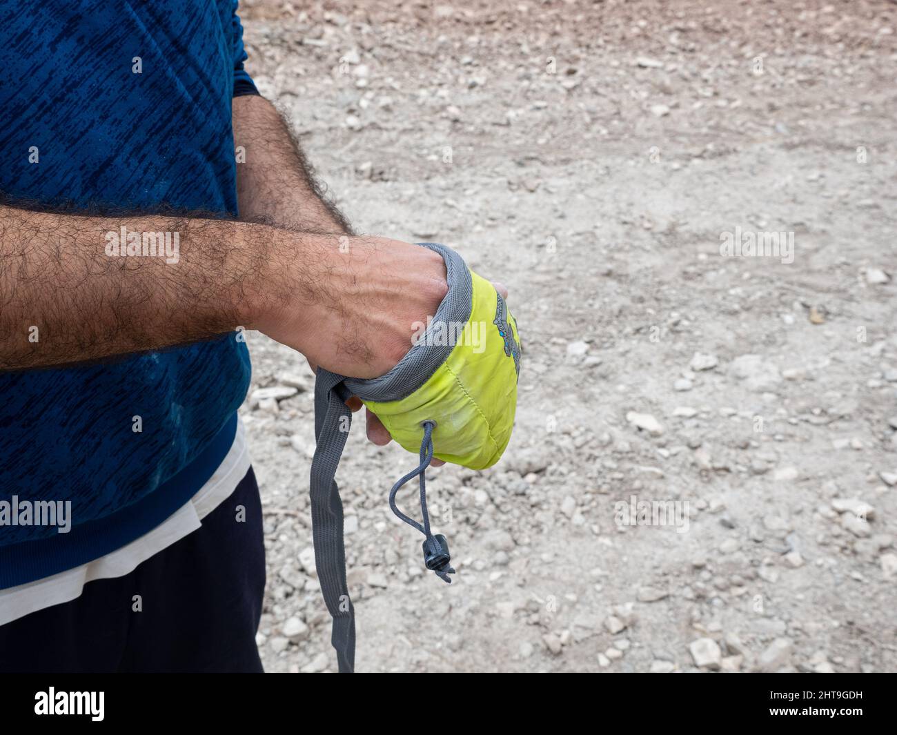 Closeup of Rock climber's hands rubbing chalk in preparation for