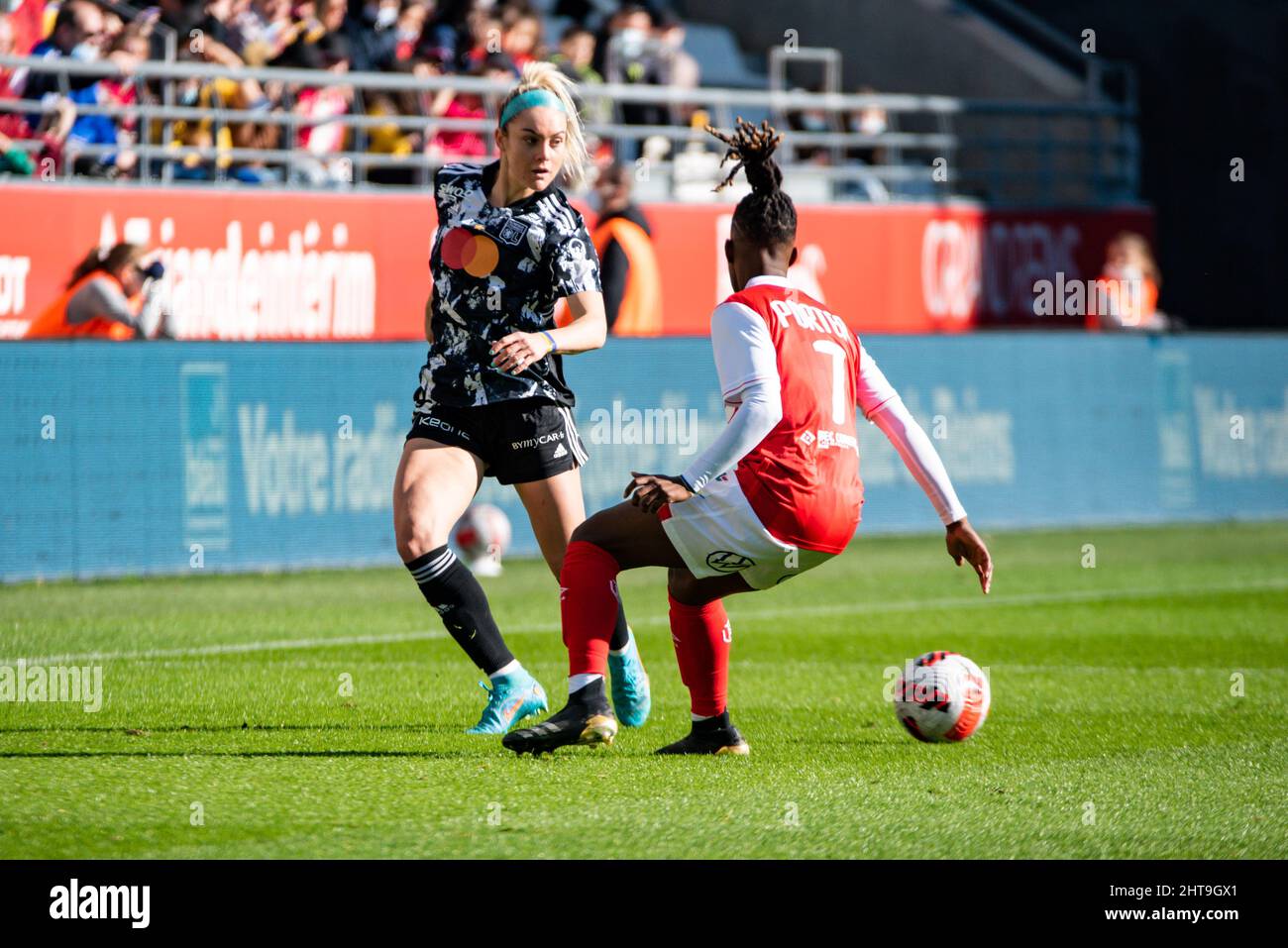 Ellie Carpenter of Olympique Lyonnais and Miracle Porter of Stade de Reims  fight for the ball during the Women's French championship, D1 Arkema  football match between Stade de Reims and Olympique Lyonnais (