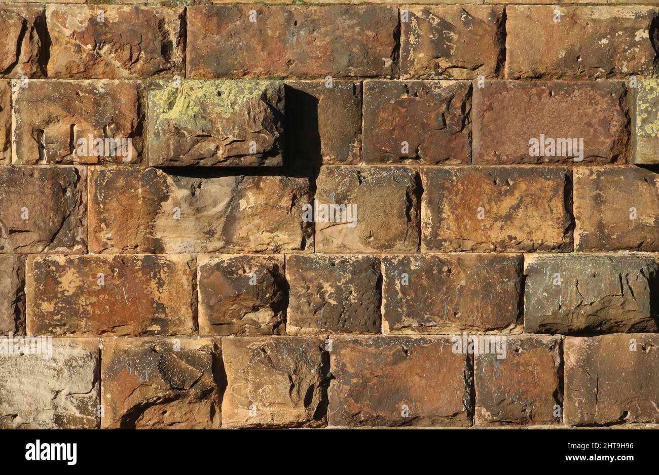 Close up showing details of the stone blocks on one of the rusticated masonry river piers of Carlisle bridge, or Lune bridge, Lancaster. Stock Photo