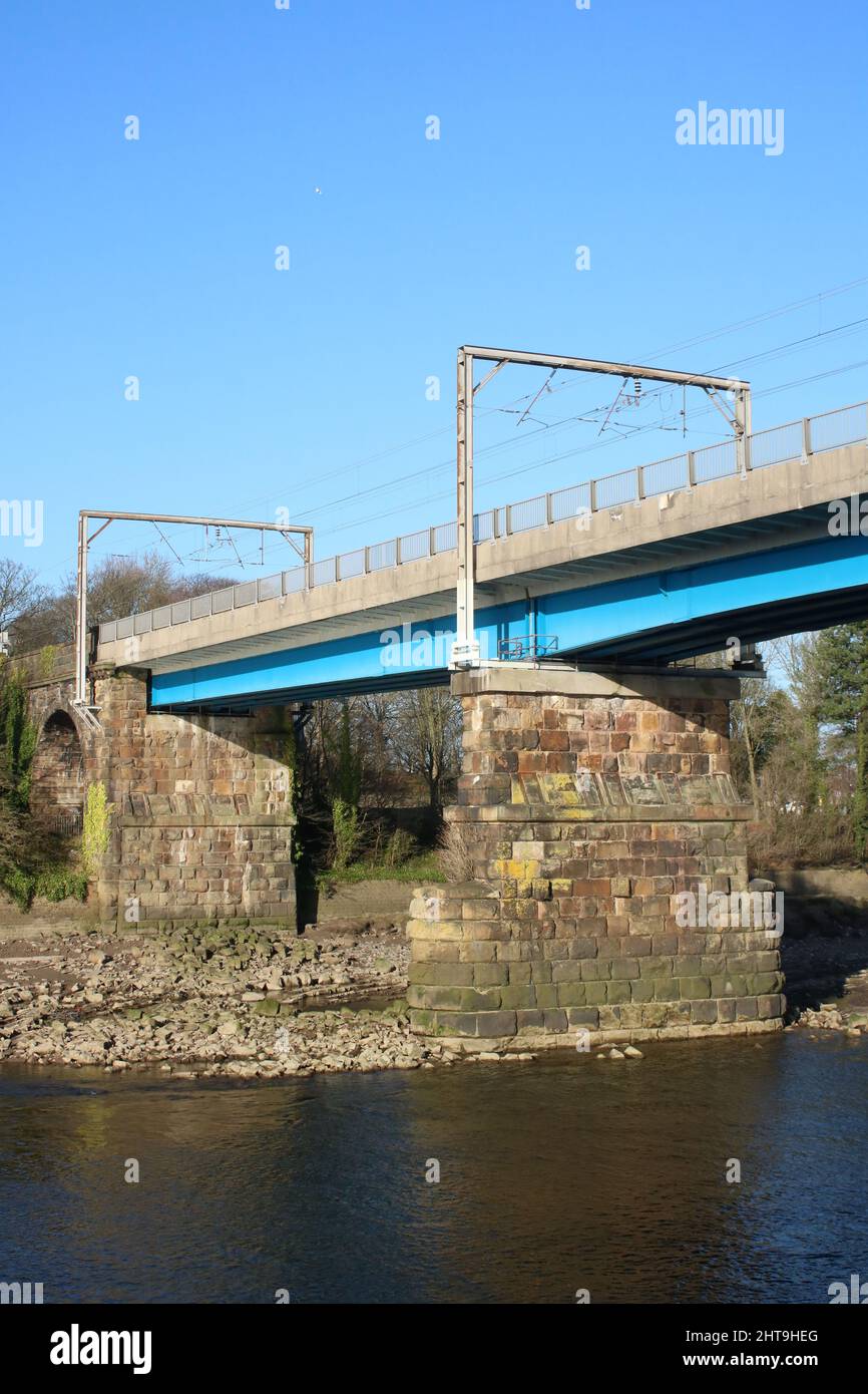 View of northern piers of Carlisle (or Lune) Bridge which carries the West Coast Main line railway over the River Lune at Lancaster. Stock Photo