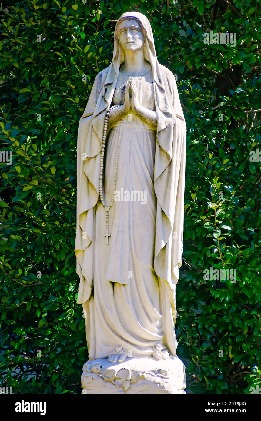 A statue of the Virgin Mary stands outside McGill-Toolen Catholic High School, Feb. 19, 2022, in Mobile, Alabama. Stock Photo