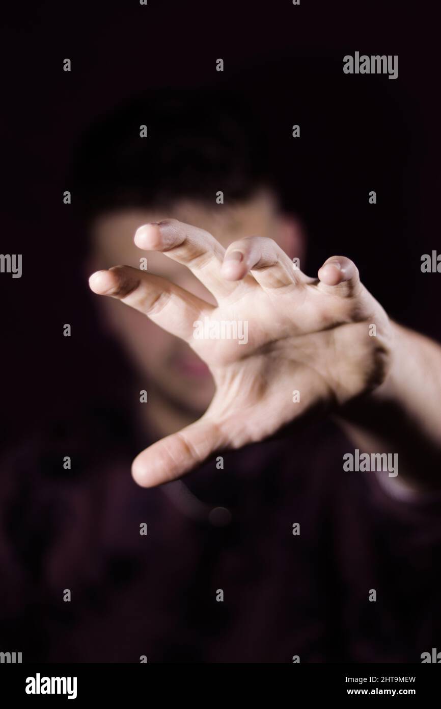 Vertical shot of a man's hand reaching forward Stock Photo Alamy