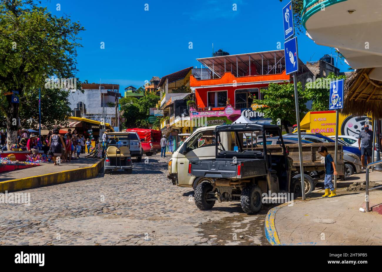 Street photography of cars, the local market, and colorful buildings in
