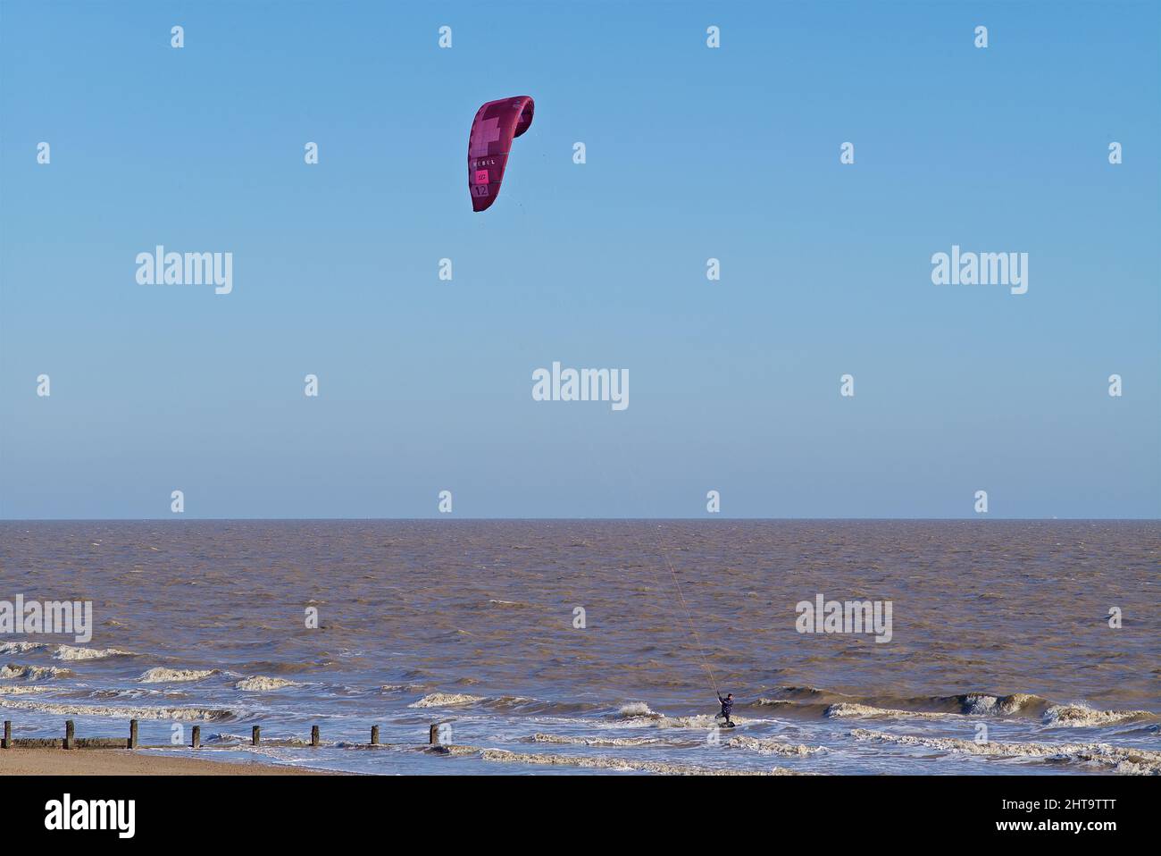 Kite surfers braving the strong winds off Fronton on Sea Essex UK. Stock Photo