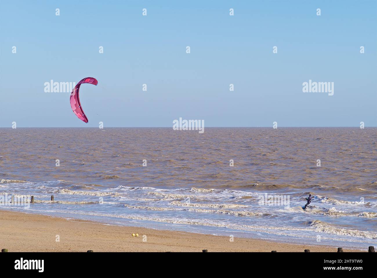 Kite surfers braving the strong winds off Fronton on Sea Essex UK. Stock Photo