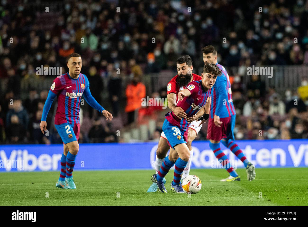Barcelona, Spain. 27th February 2022 ;  Nou Camp, Barcelona, Spain: La liga football, FC Barcelona versus Athletic Bilbao; 30 Pablo Martin Paez Gavira of FC Barcelona is grabbed and pulled back as he heads for goal Credit: Action Plus Sports Images/Alamy Live News Stock Photo