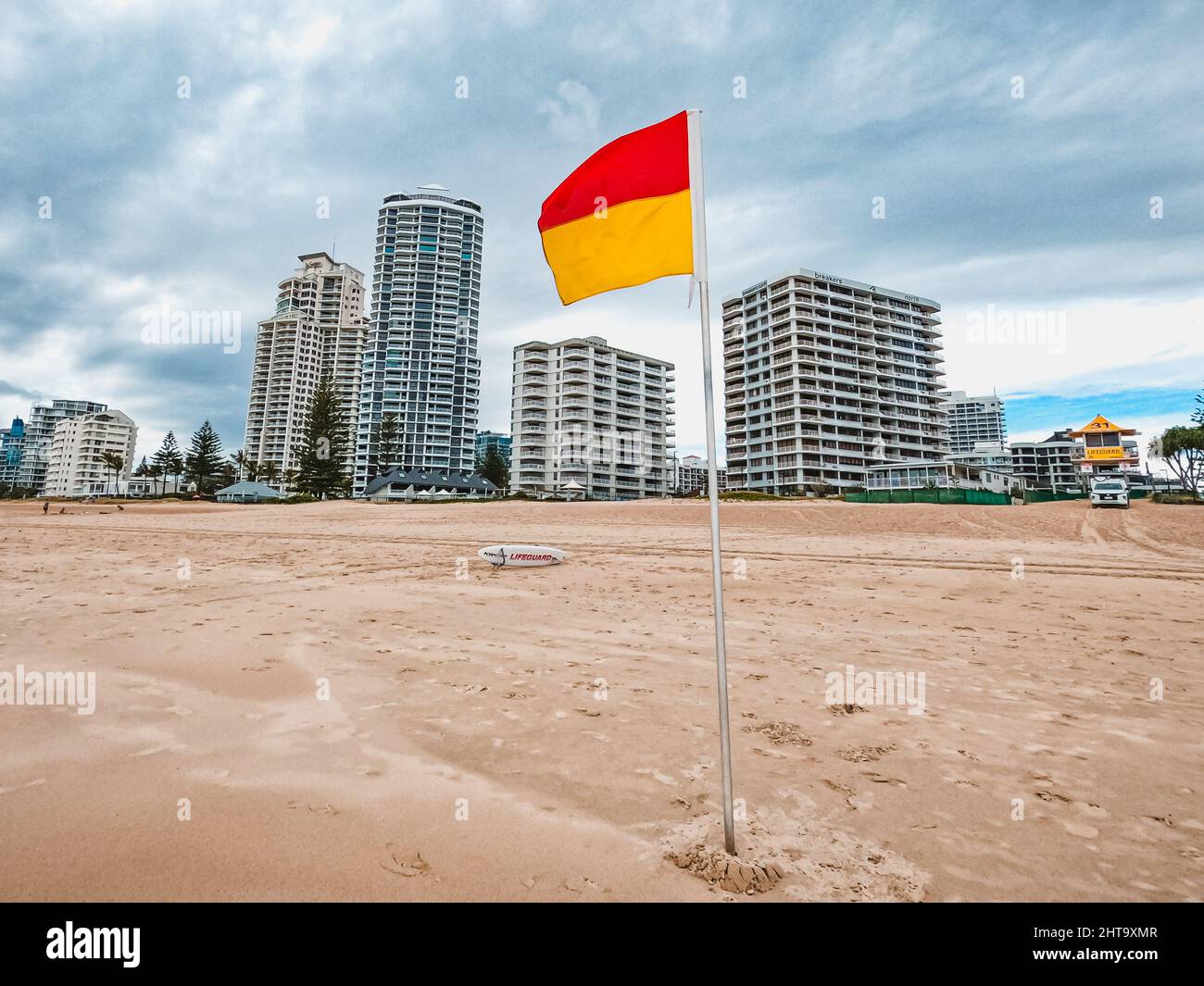 Red and yellow warning flag on the beach in Gold Coast, Queensland