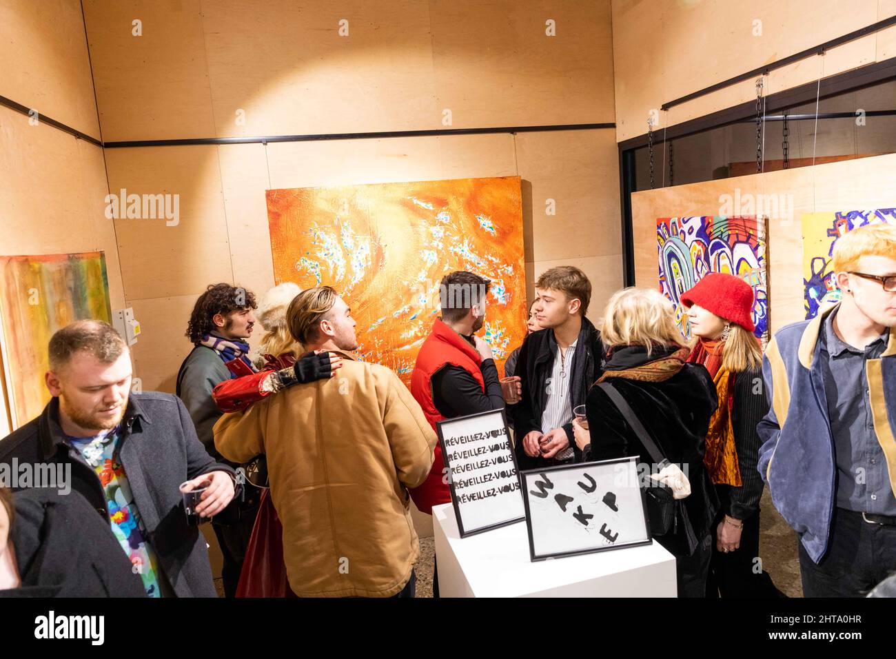 Audience during an art exhibition opening in the vibrant Stock Photo Alamy