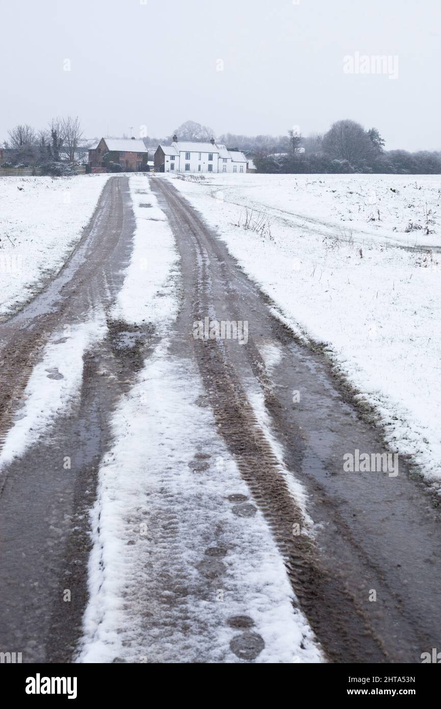 Track to farmhouse through snow at Beverley Westwood, East Yorkshire UK following storm Eunice February 2022 Stock Photo