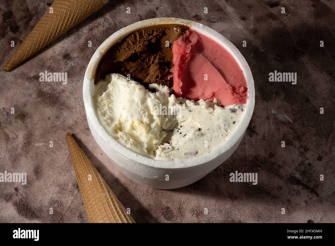 Different flavors of ice cream with waffle cones Stock Photo - Alamy