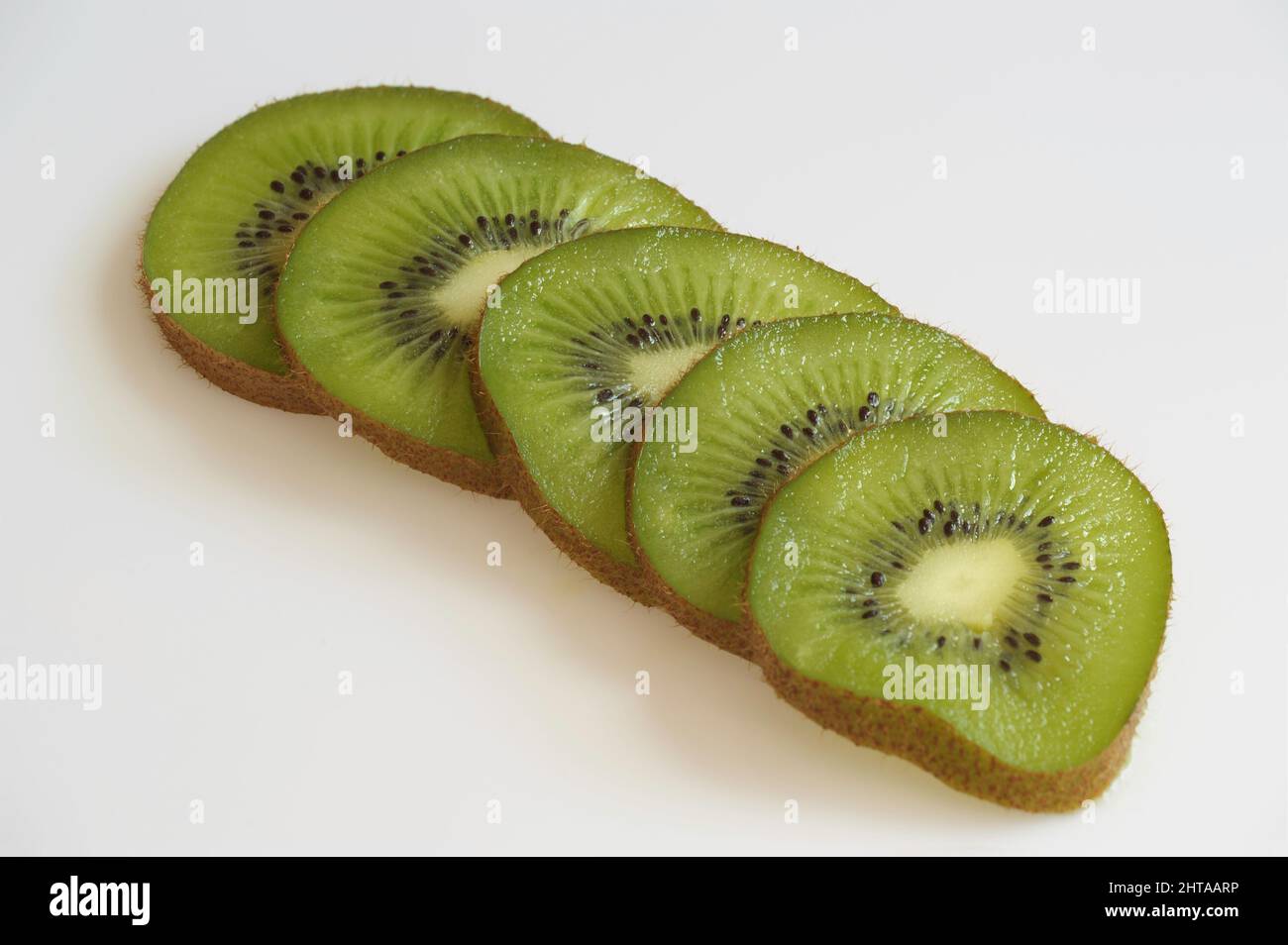 kiwifruit or Chinese gooseberry are an edible fruit of the family Actinidiaceae, high in Vitamin C Stock Photo
