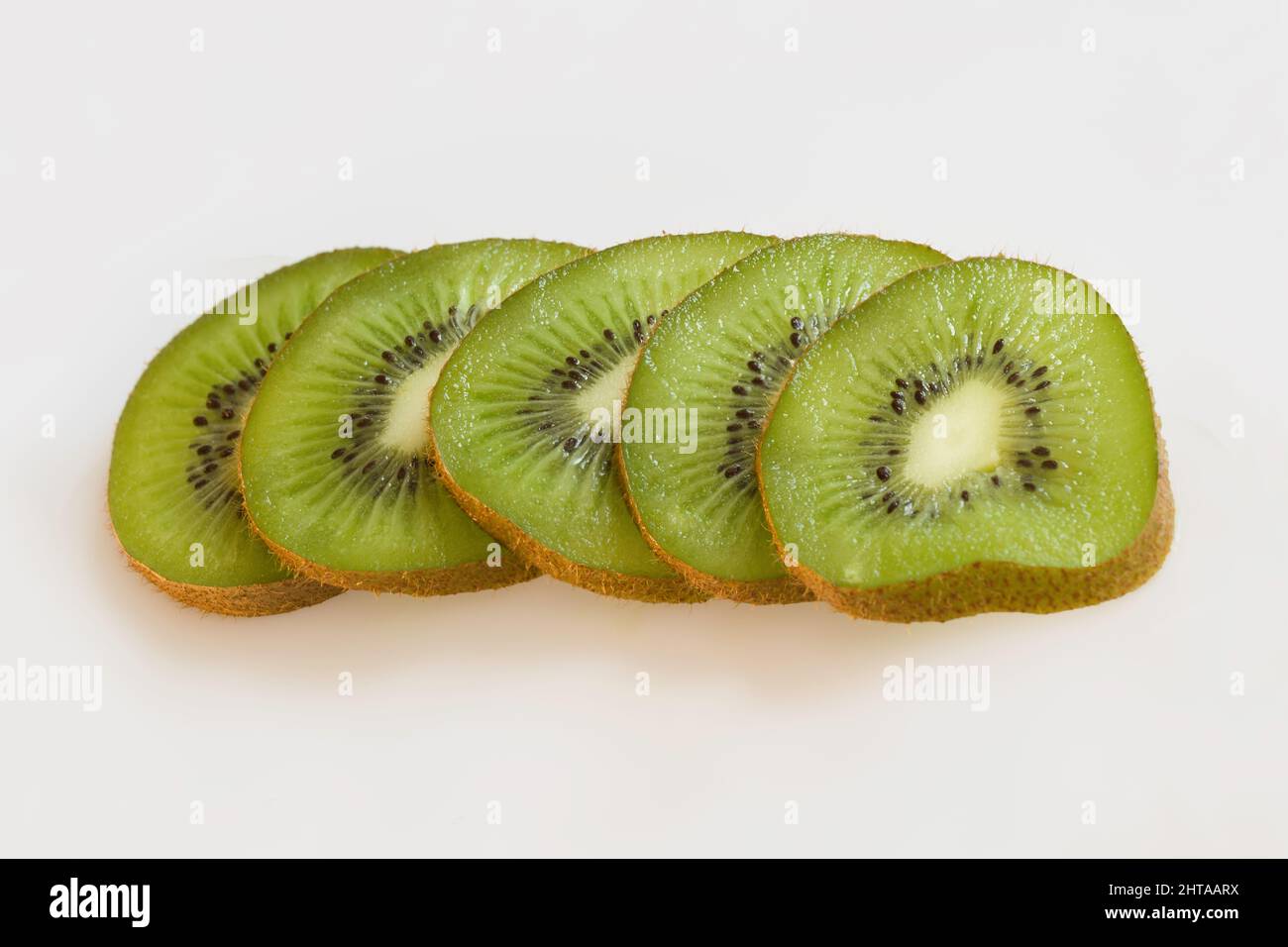 kiwifruit or Chinese gooseberry are an edible fruit of the family Actinidiaceae, high in Vitamin C Stock Photo