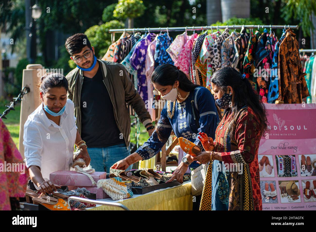 CALIS, TURKEY, 12TH AUGUST 2015: An english lady buying fake shoes from a  market stall in calis in turkey, 12th august 2015 Stock Photo - Alamy