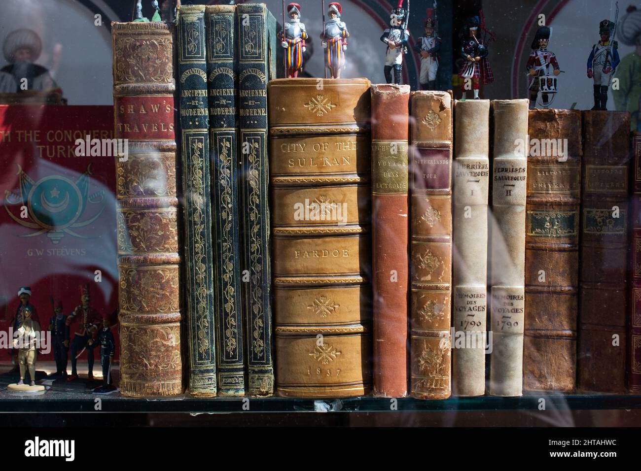 Closeup of various old books on a shelf Stock Photo - Alamy