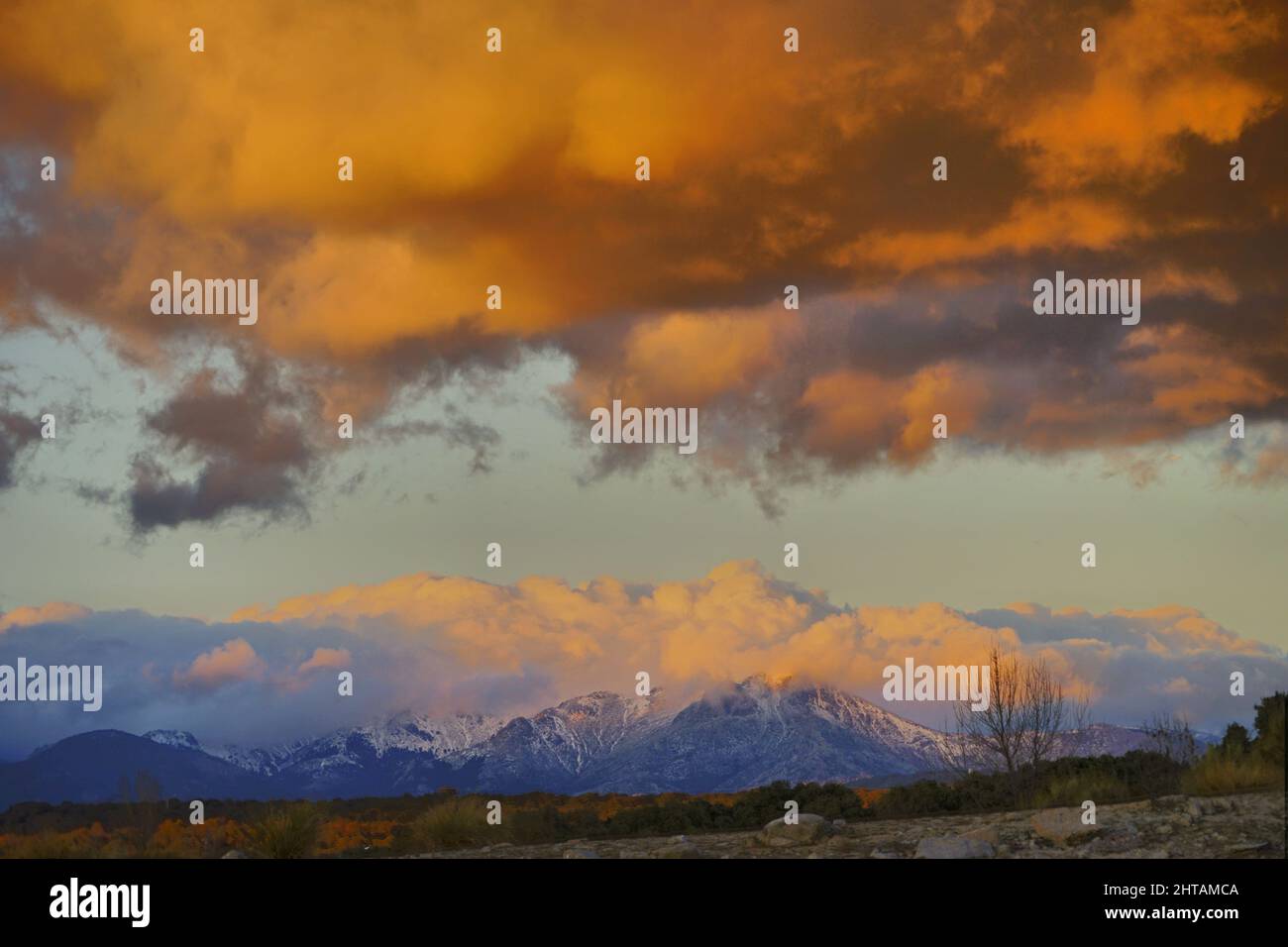 Landscape of clouds above the snowy mountains Stock Photo - Alamy