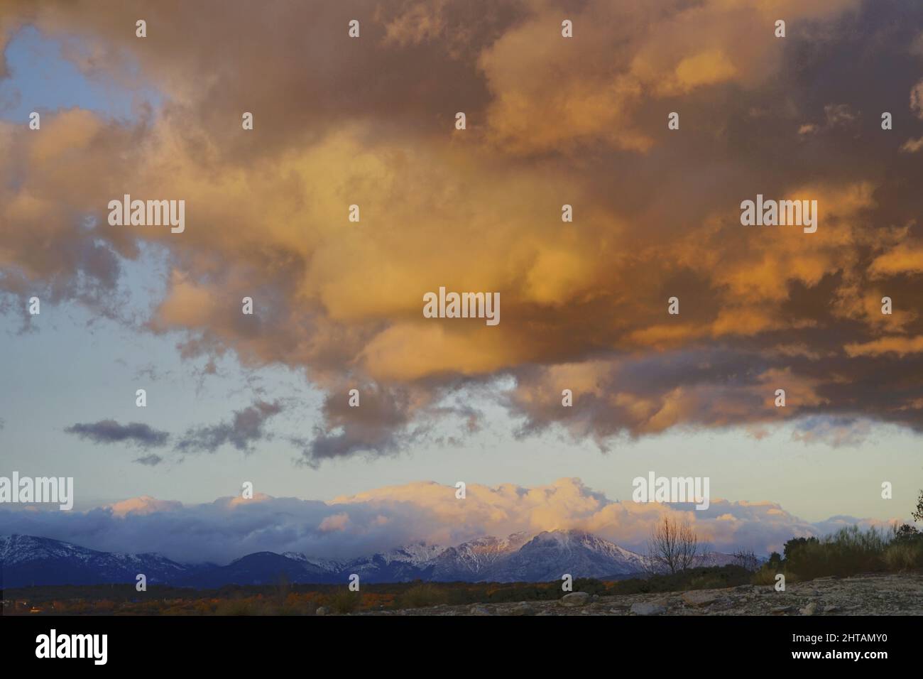 Landscape of clouds above the snowy mountains Stock Photo - Alamy