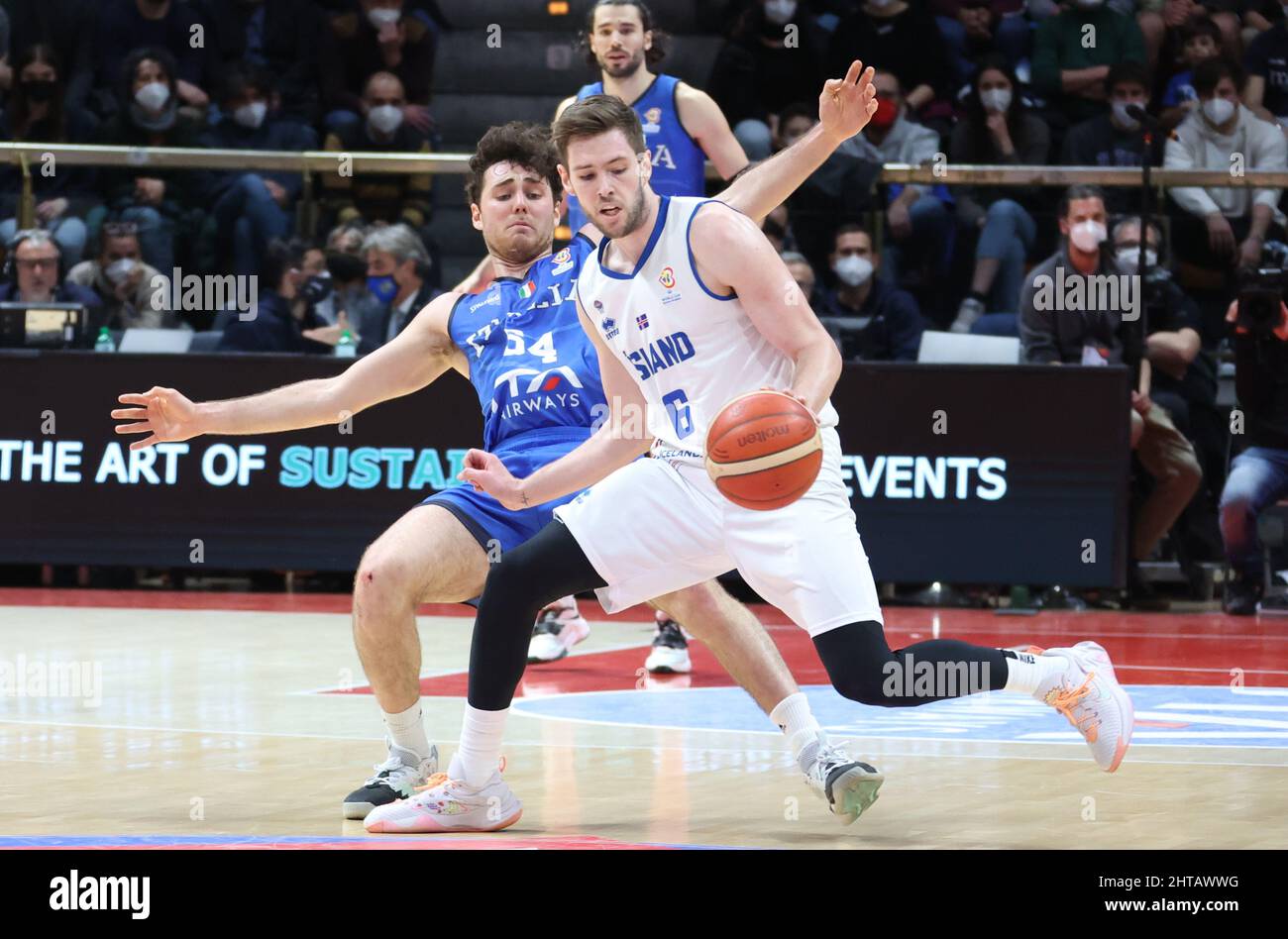 Jon Axel Gudmundsson (Iceland) (R) thwarted by  Alessandro Pajola (Italy) during the FIBA World Cup 2023 qualifiers game Italy Vs. Iceland at the Paladozza sports palace in Bologna, February 27, 2022 - Photo: Michele Nucci Stock Photo