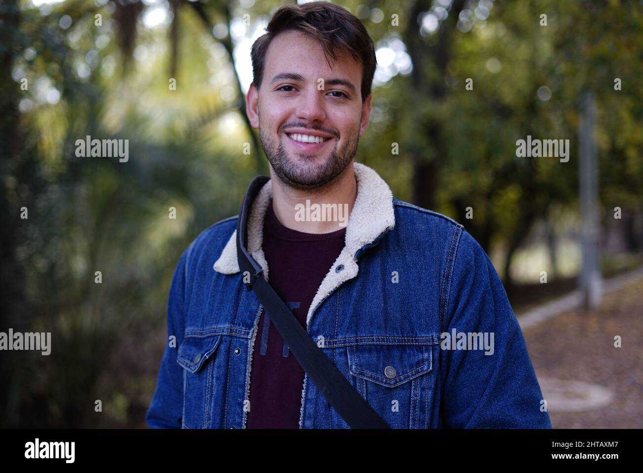Young White guy smiling looking in the camera dressed casually Stock Photo