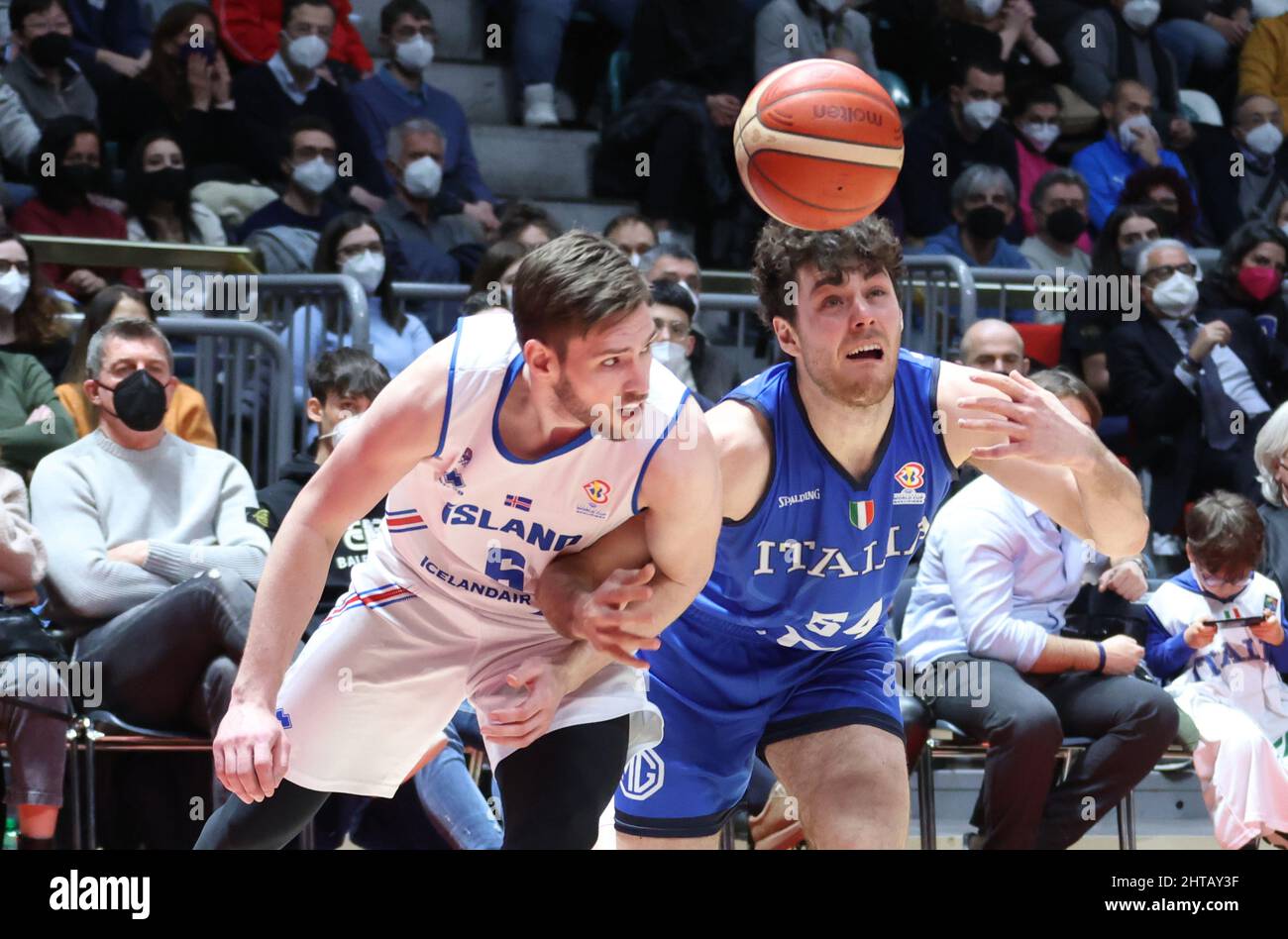 Jon Axel Gudmundsson (Iceland) (L) thwarted by  Alessandro Pajola (Italy) during the FIBA World Cup 2023 qualifiers game Italy Vs. Iceland at the Paladozza sports palace in Bologna, February 27, 2022 - Photo: Michele Nucci Stock Photo