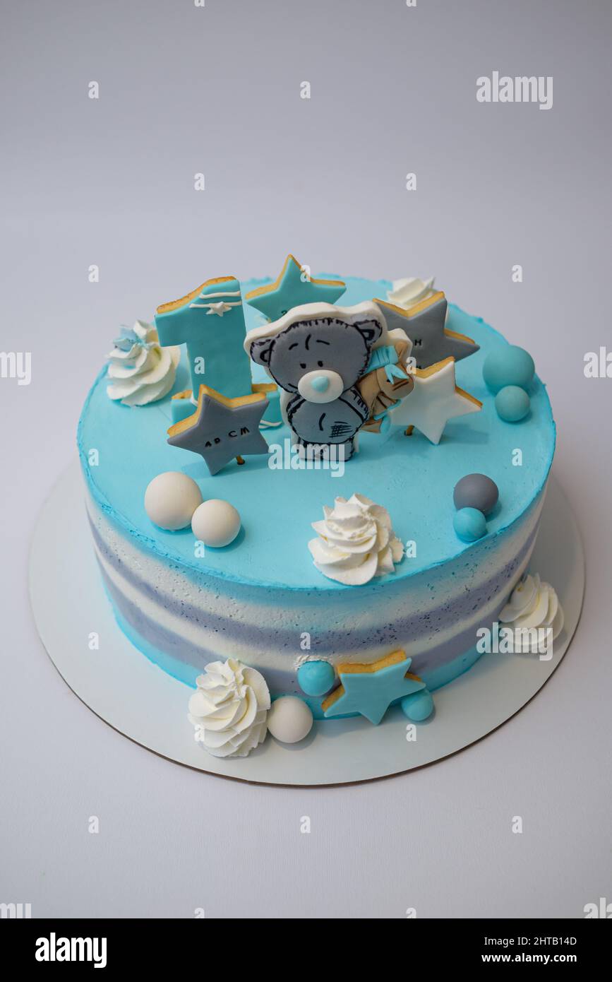 Photo of a birthday cake for a one year old boy with teddy bear and ...