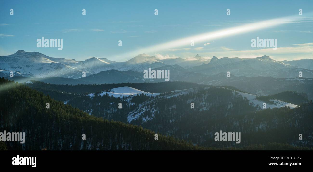 Panoramic aerial view of a large green range with blue cloudy sky on ...
