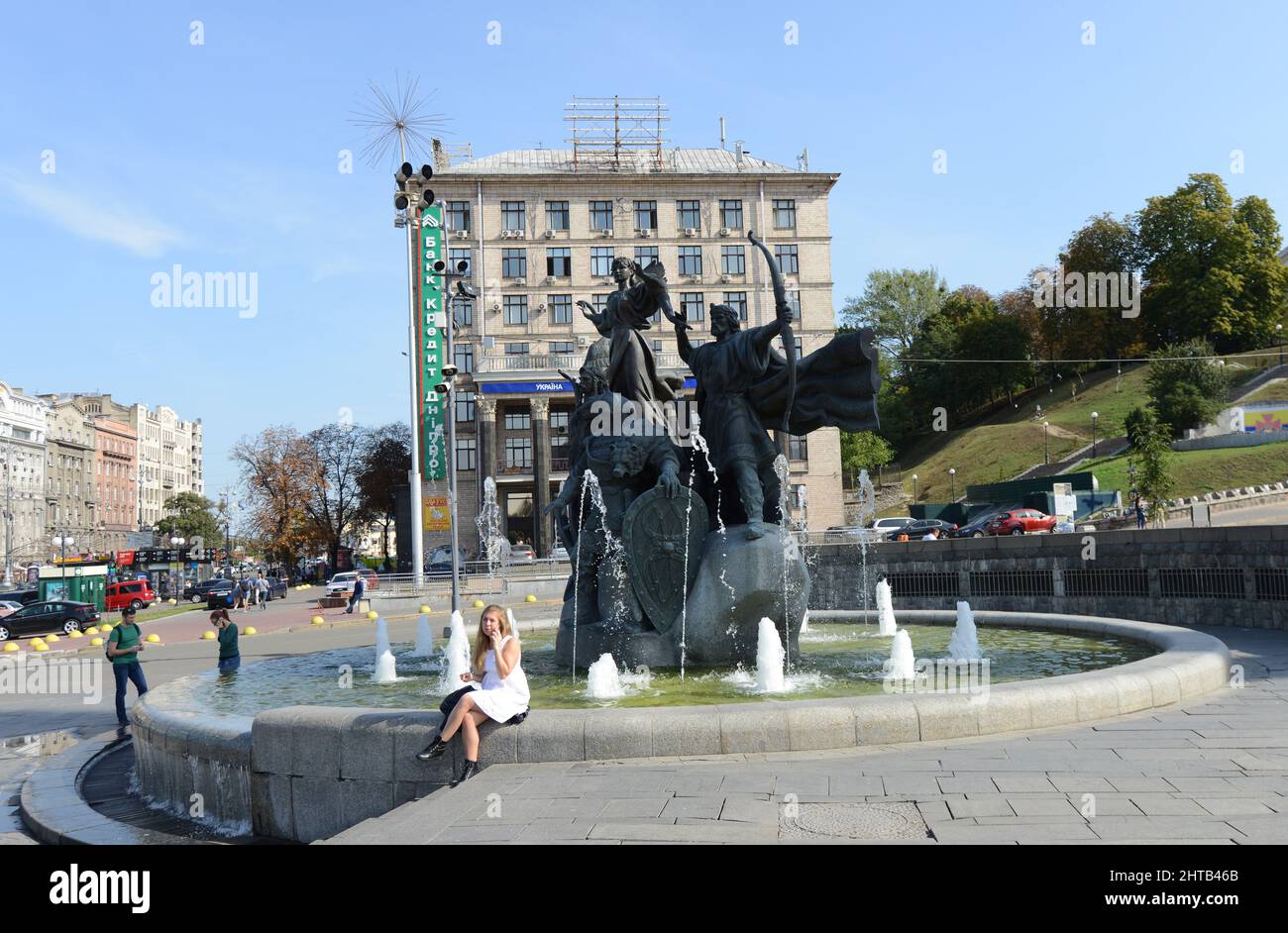 Monument to Founders of Kiev - Kyi, Shchek, Khoryv and Lybid on Independence Square, Kiev, Ukraine. Hotel Ukrayina on background Stock Photo