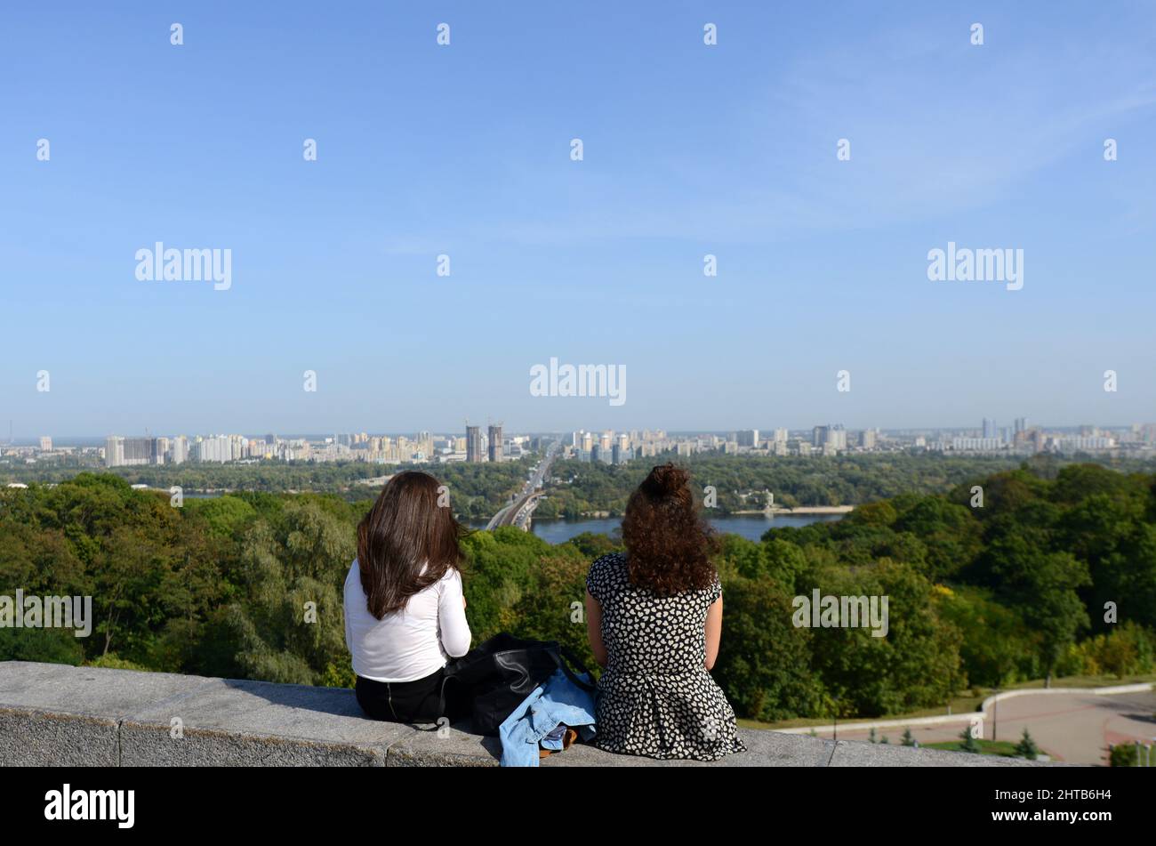 Ukrainian women enjoying the views of the Dnipro river from the park of eternal glory in Kyiv, Ukraine. Stock Photo