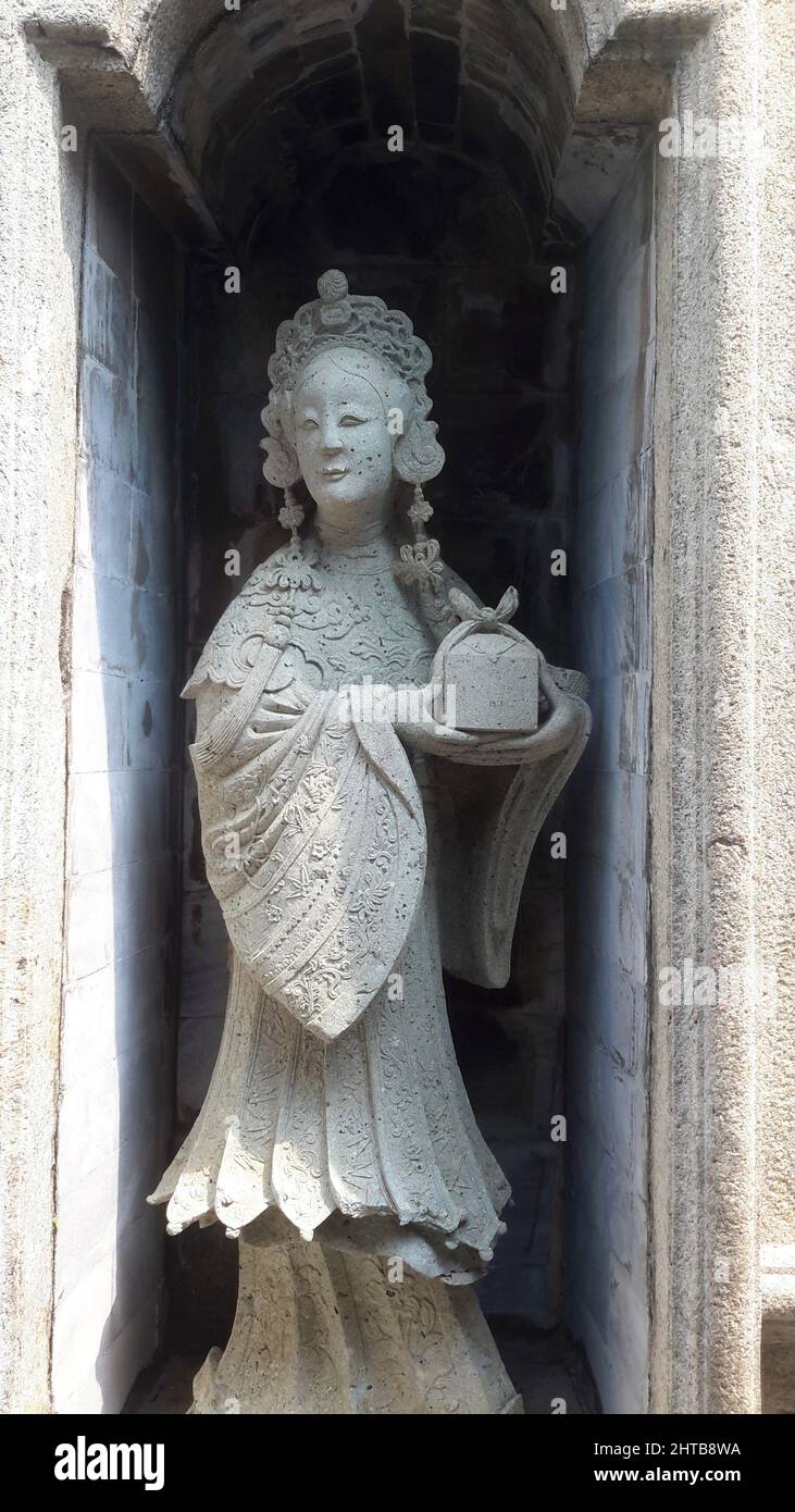 Closeup of a Chinese ballast doll in a Thai temple Stock Photo Alamy