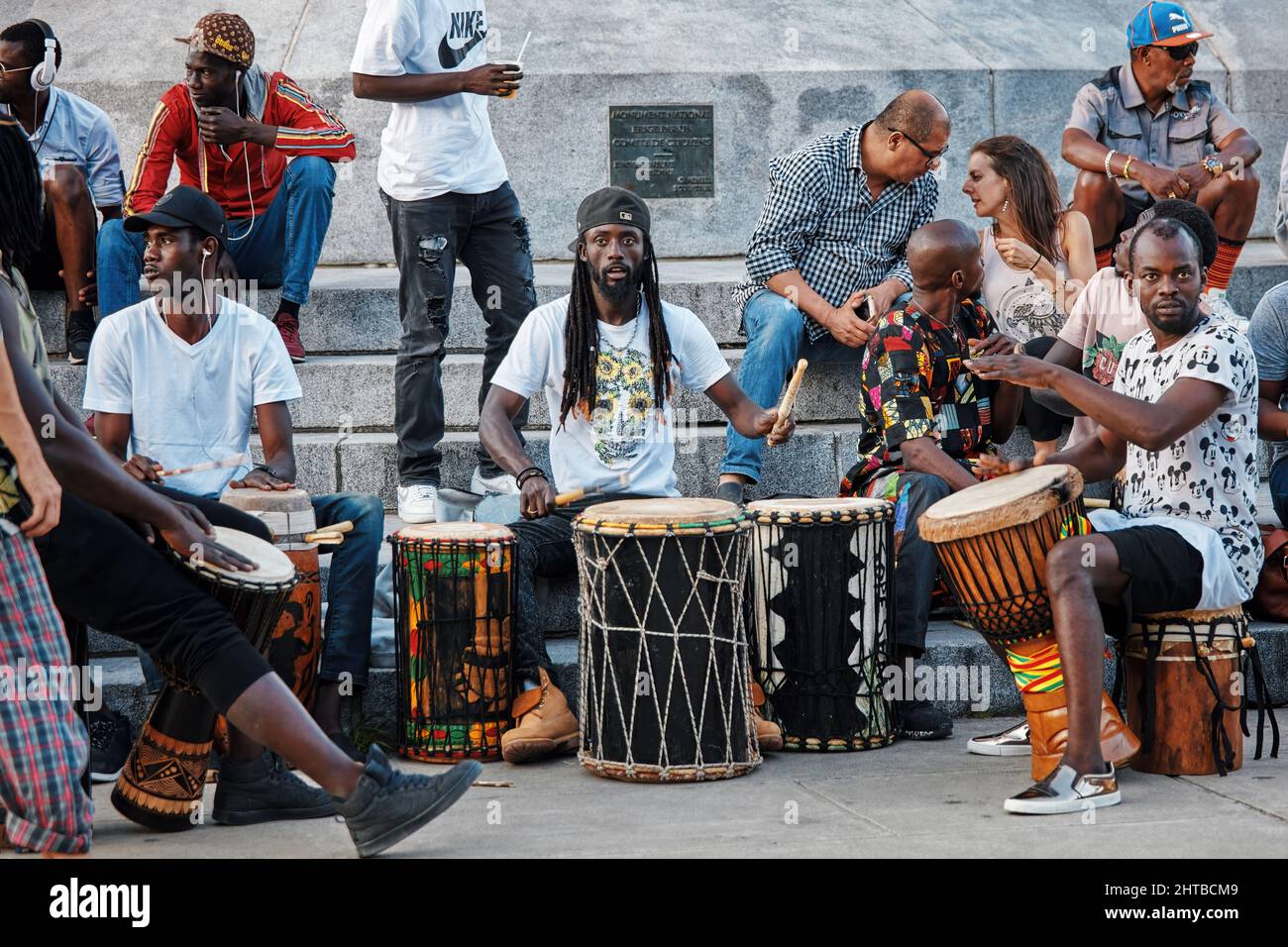 June, 2018 - Montreal, Canada: African American males playing drums and  djembe bongo in mount royal park in Montreal, Canada Stock Photo - Alamy