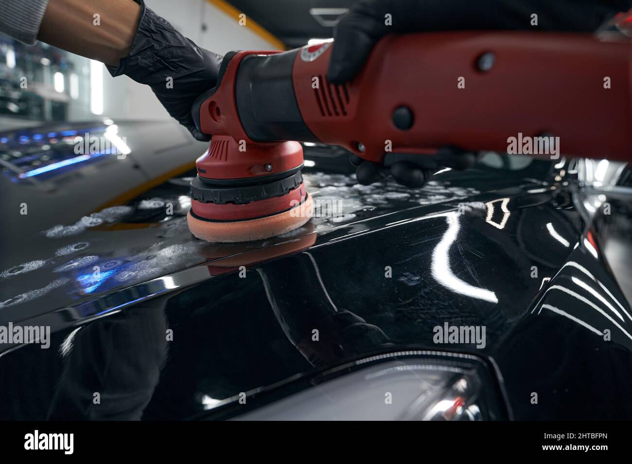Gloved hands buffing exterior of motor vehicle Stock Photo Alamy