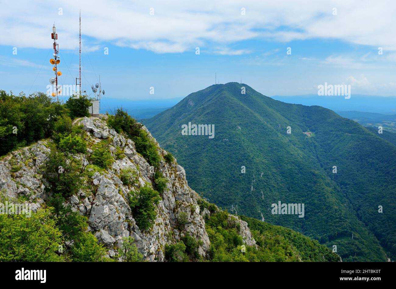 Aerial view of the blue sky over the green hills on a sunny day in ...
