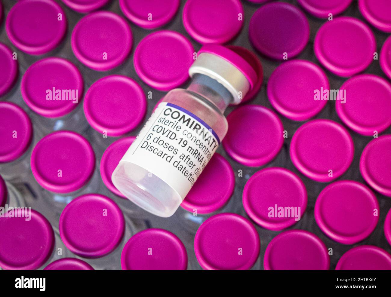 Berlin, Germany - February, 2022: Covid-19 mRNA Vaccine bottles by Biontech / Pfizer Stock Photo