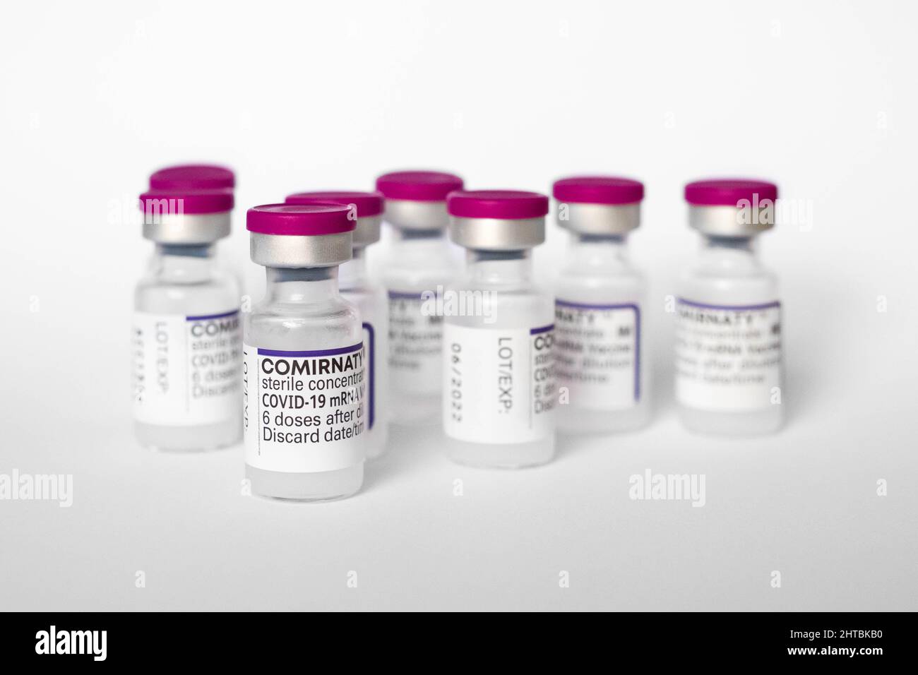 Berlin, Germany - February, 2022: Covid-19 mRNA Vaccine bottles by Biontech / Pfizer Stock Photo