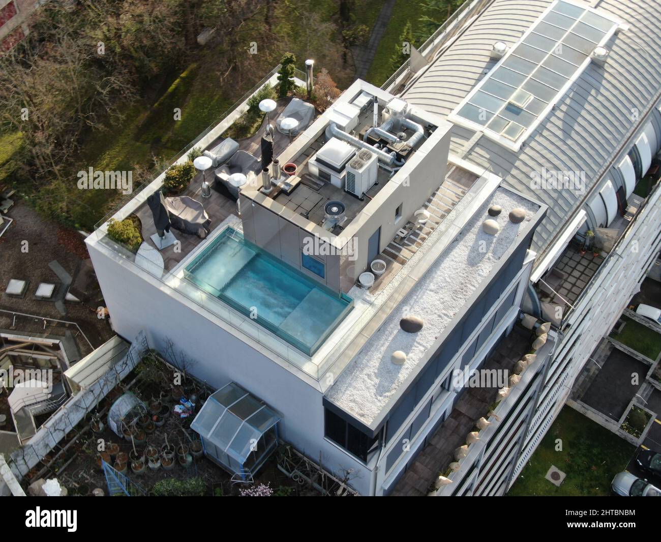 Image showcasing Aerial shot of a rooftop with a swimming pool of an upscale apartment ...