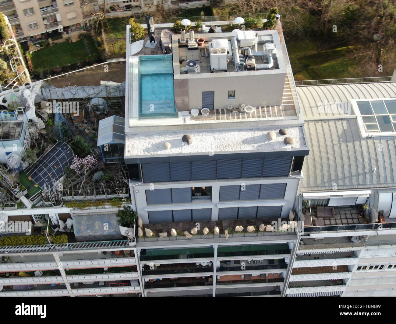 Image showcasing Aerial shot of a rooftop with a swimming pool of an upscale apartment ...