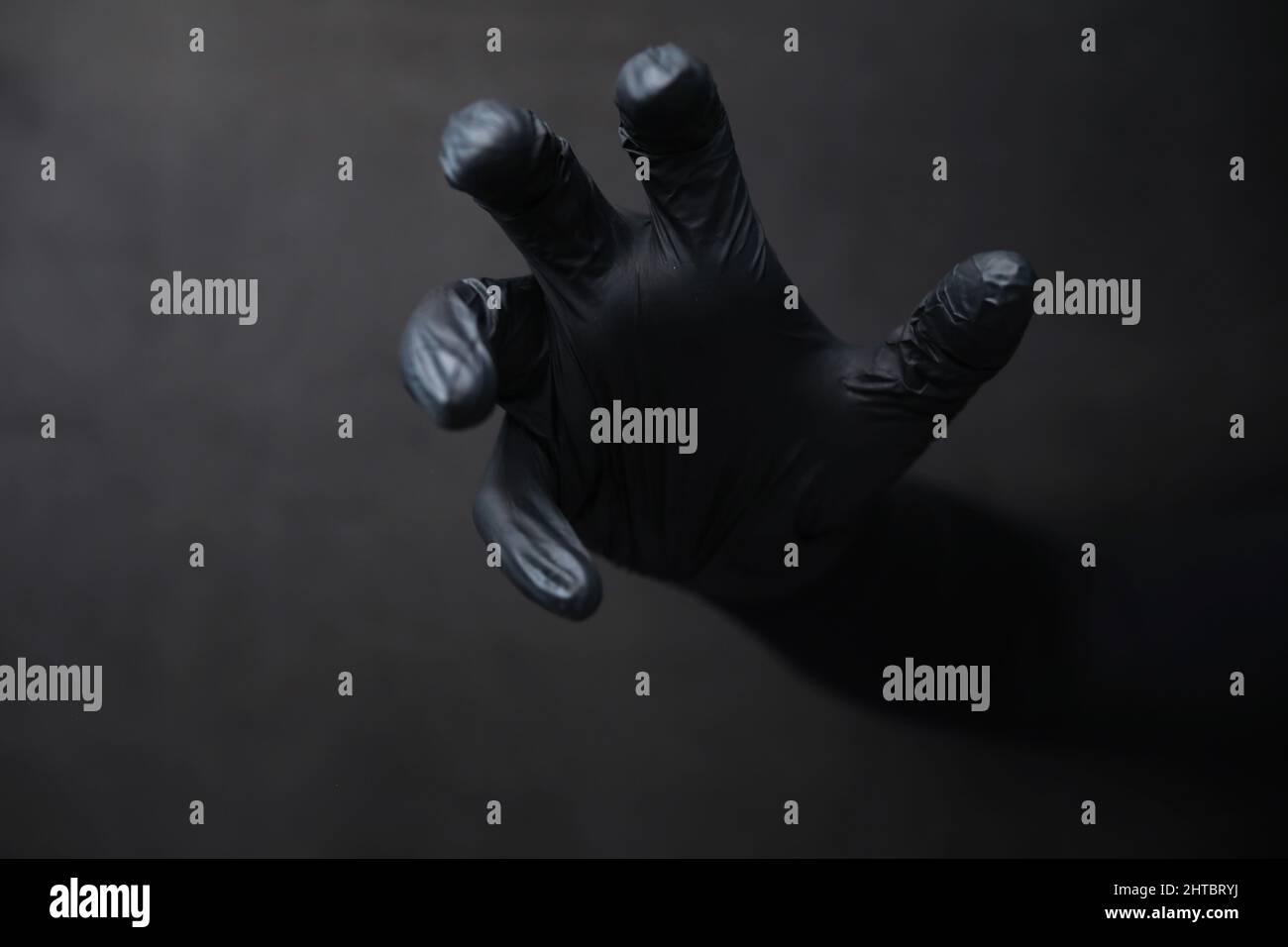 Background of hands in gloves. Black gloves. Hand gestures black gloves