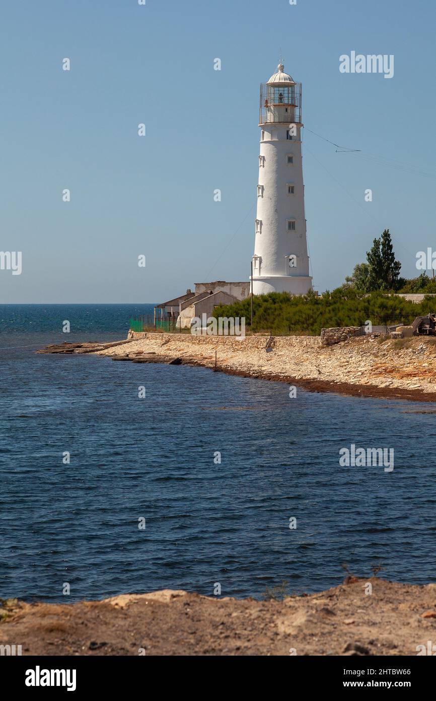 Tarkhankut lighthouse on the coast of the Crimean peninsula. Stock Photo