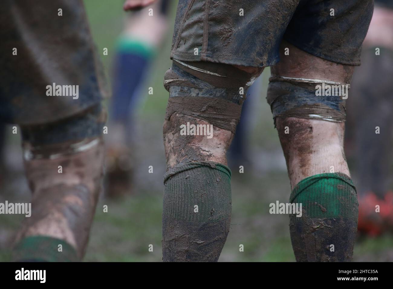 Closeup photo of feet of rugby players. Stock Photo