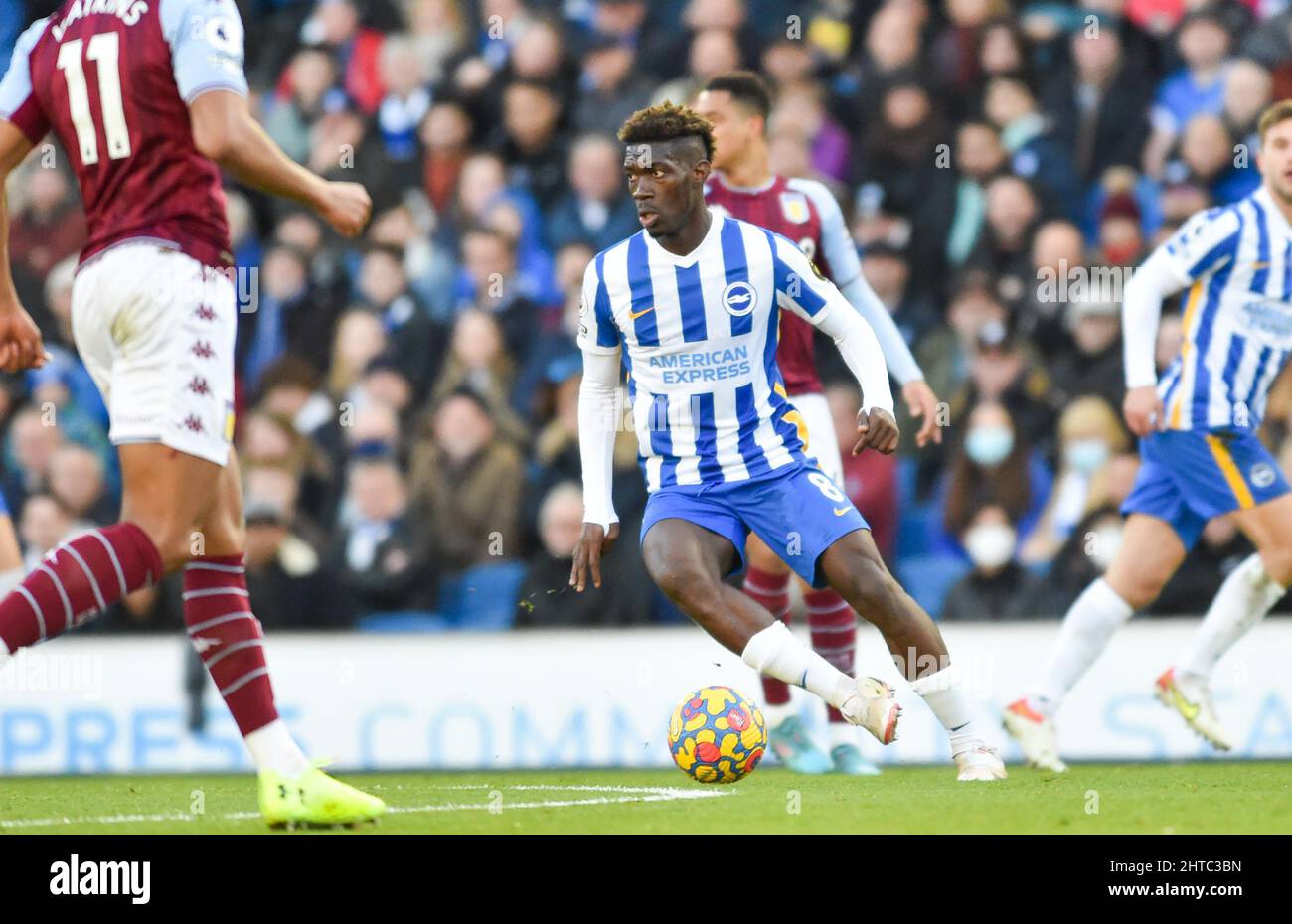 Yves Bissouma of Brighton on the ball during the Premier League match between Brighton and Hove Albion and Aston Villa at the American Express Stadium  , Brighton , UK - 26th February 2022 - Photo Simon Dack/Telephoto Images. Editorial use only. No merchandising. For Football images FA and Premier League restrictions apply inc. no internet/mobile usage without FAPL license - for details contact Football Dataco Stock Photo