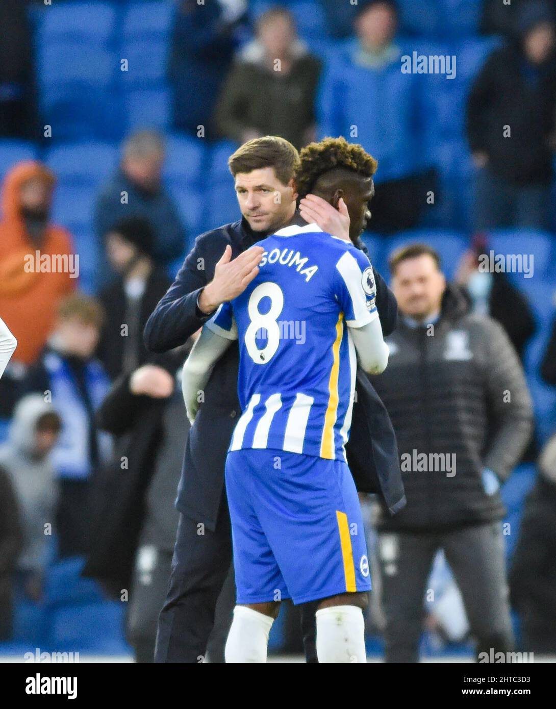 Aston Villa head coach Steven Gerrard hugs Yves Bissouma of Brighton after the Premier League match between Brighton and Hove Albion and Aston Villa at the American Express Stadium  , Brighton , UK - 26th February 2022  Photo Simon Dack/Telephoto Images.  - Editorial use only. No merchandising. For Football images FA and Premier League restrictions apply inc. no internet/mobile usage without FAPL license - for details contact Football Dataco Stock Photo