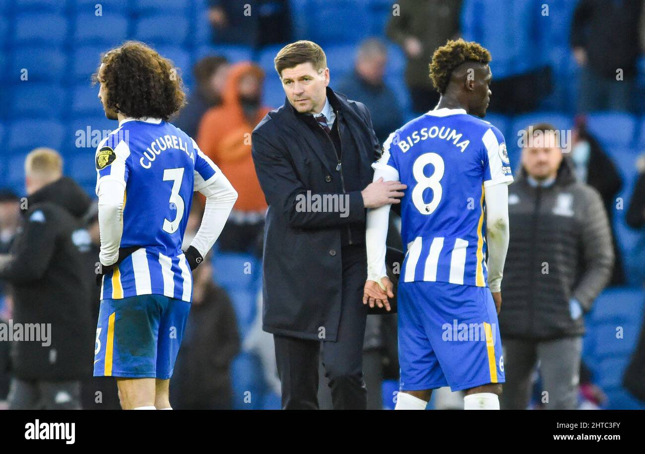 Aston Villa head coach Steven Gerrard with Yves Bissouma of Brighton during the Premier League match between Brighton and Hove Albion and Aston Villa at the American Express Stadium  , Brighton , UK - 26th February 2022 Photo Simon Dack/Telephoto Images. - Editorial use only. No merchandising. For Football images FA and Premier League restrictions apply inc. no internet/mobile usage without FAPL license - for details contact Football Dataco Stock Photo