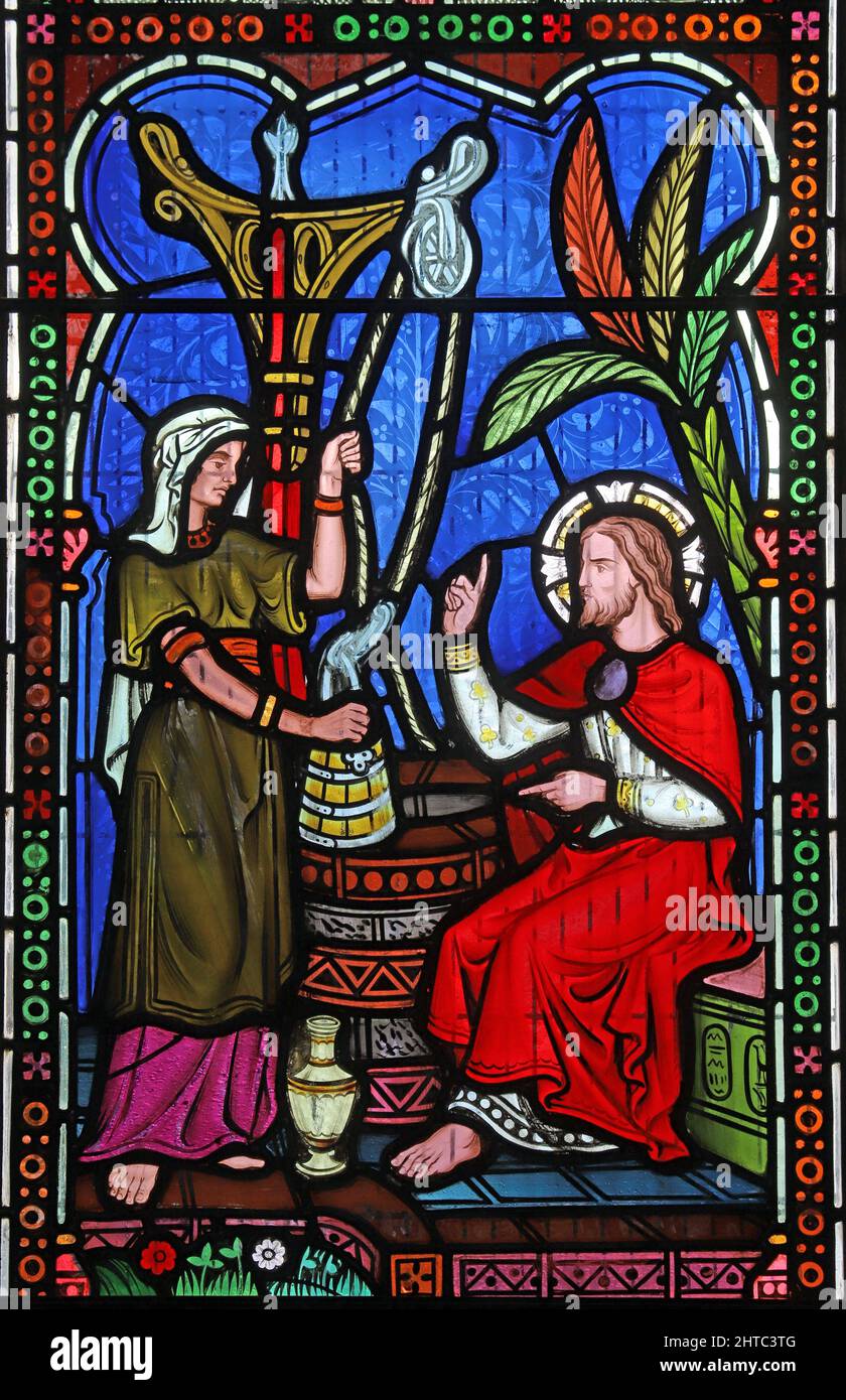 Stained glass window by Frederick Preedy depicting Christ with the Woman at the Well. St Lawrence Church, Stretton Grandison, Herefordshire Stock Photo