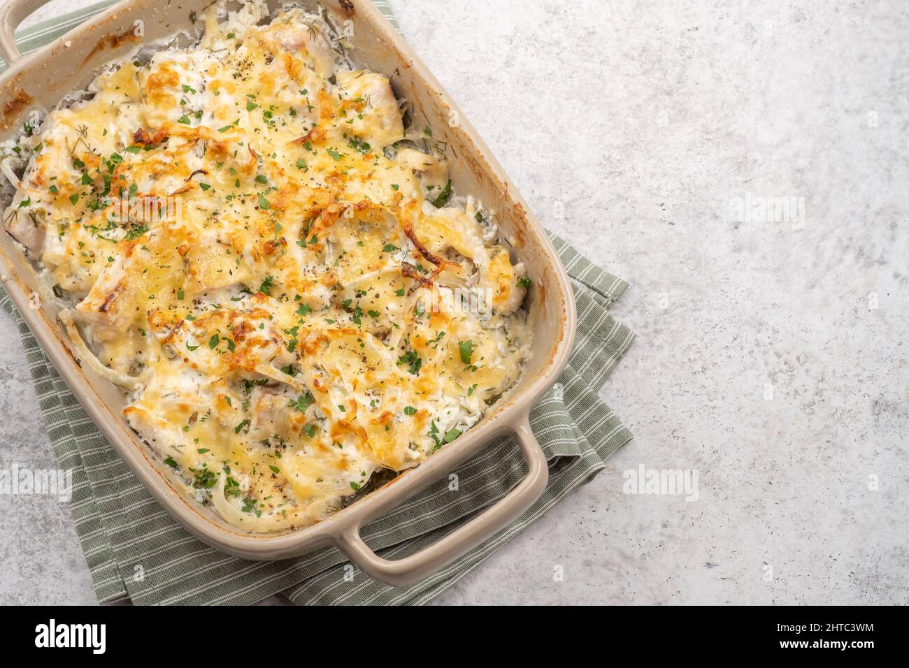 White fish casserole cauliflower, potato with cheese, sour cream and onion Stock Photo Alamy