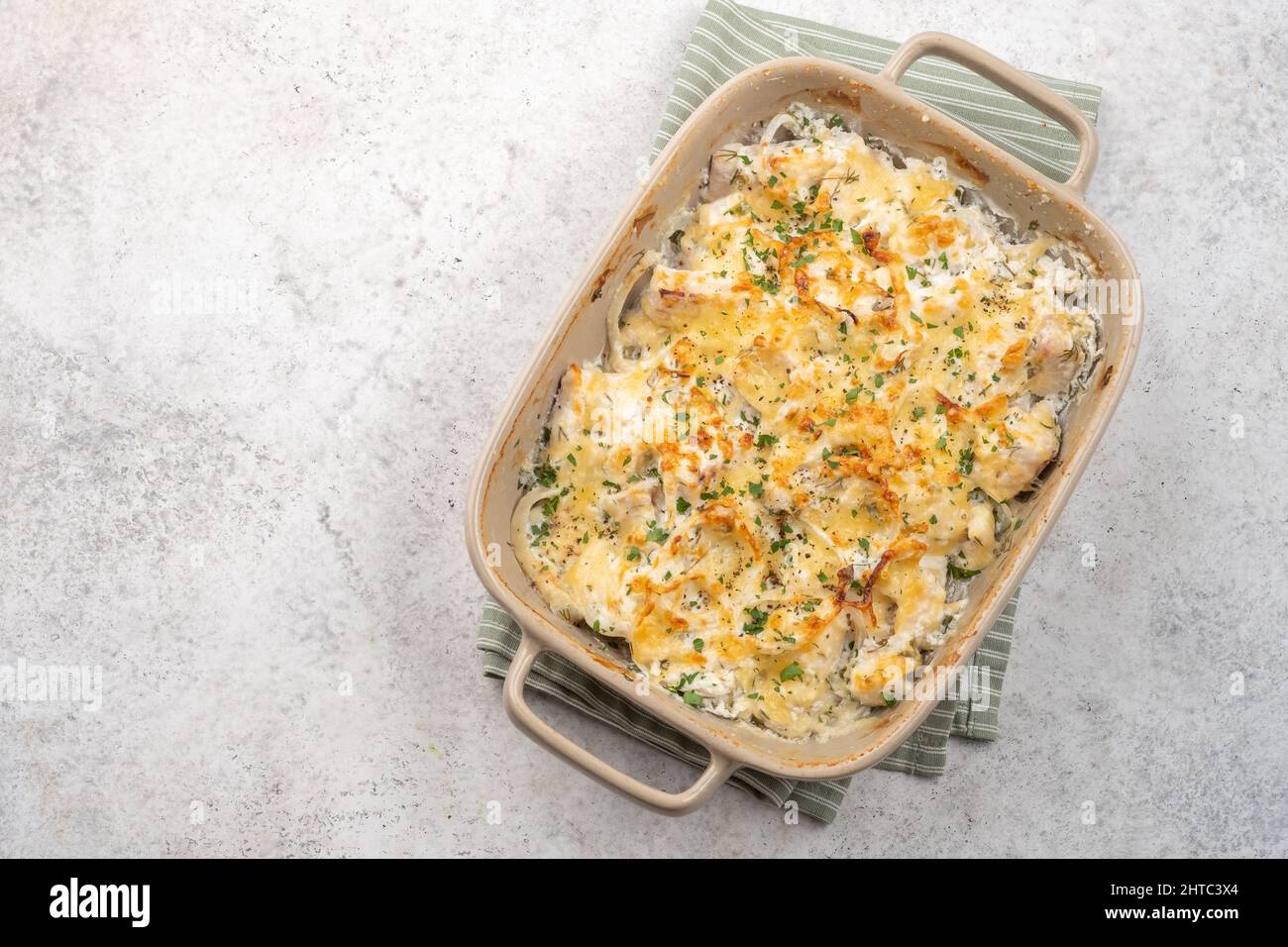 White fish casserole cauliflower, potato with cheese, sour cream and onion Stock Photo Alamy