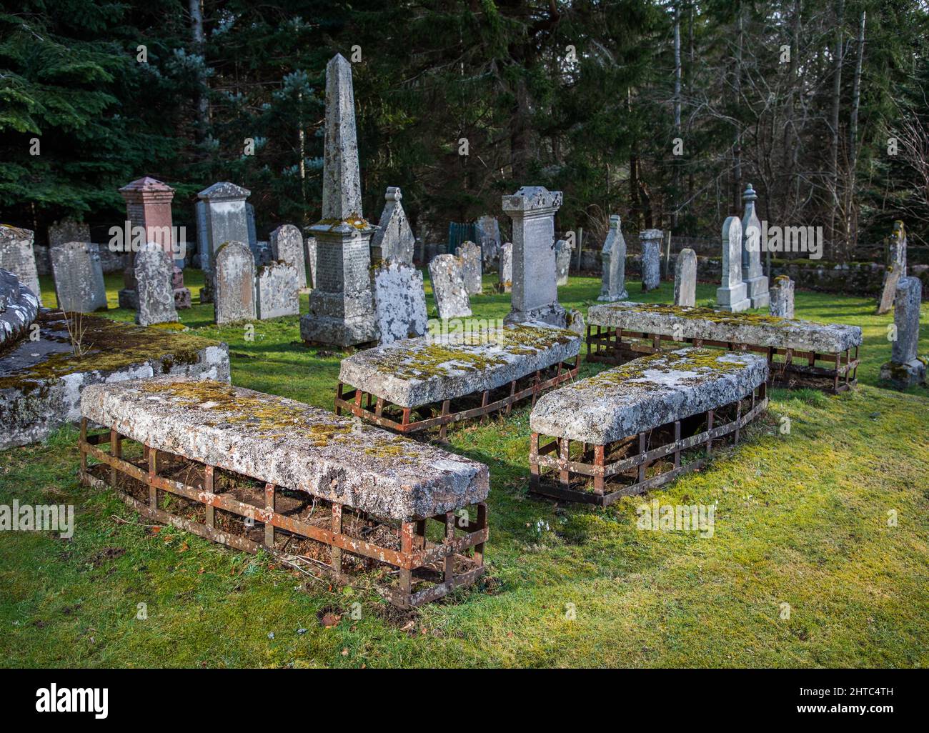 A group of four mortsafes, designed to protect graves from grave robbers in Cluny Old Kirkyard near Monymusk, in Aberdeenshire, Scotland Stock Photo