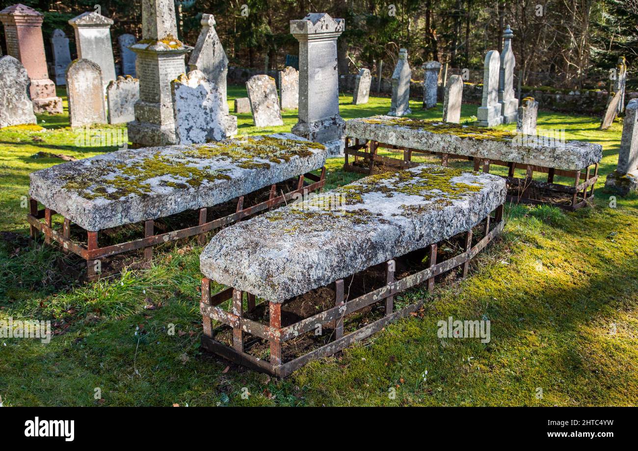 A group of four mortsafes, designed to protect graves from grave robbers in Cluny Old Kirkyard near Monymusk, in Aberdeenshire, Scotland Stock Photo