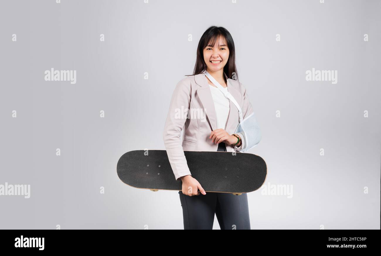 Woman smile broken arm after accident wear arm splint for treatment she