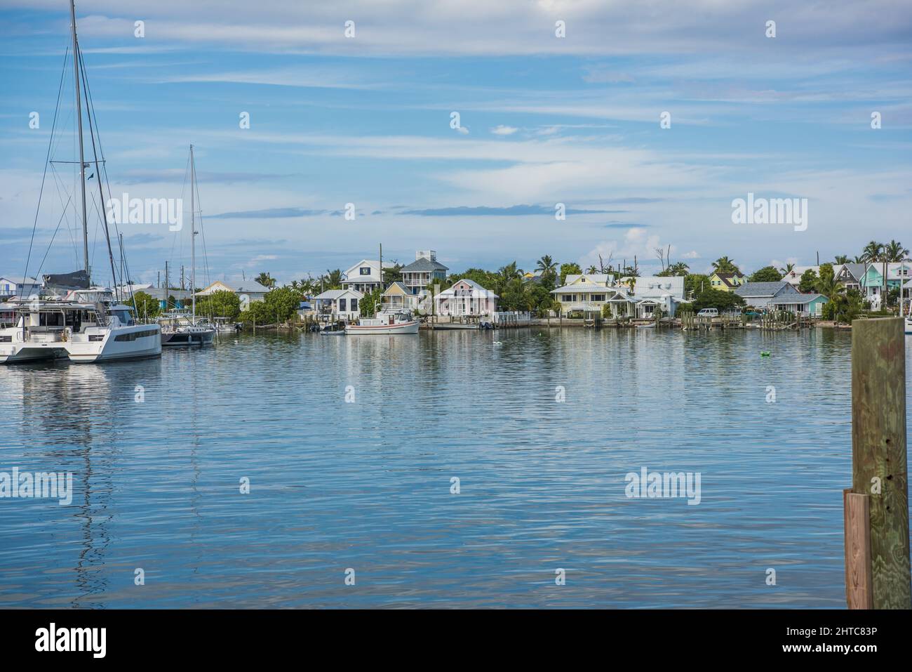 Photo of the blue sky with sailboat in the harbor in Elbow Cay, Abaco ...