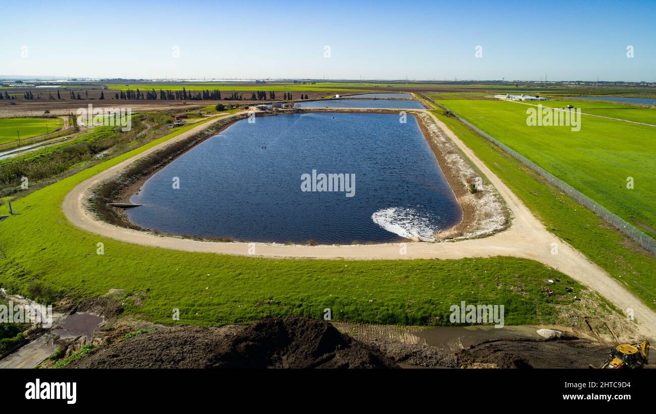 Aerial photography of a sewerage treatment facility. The treated water is then used for irrigation and agricultural use. Photographed, Israel Stock Photo